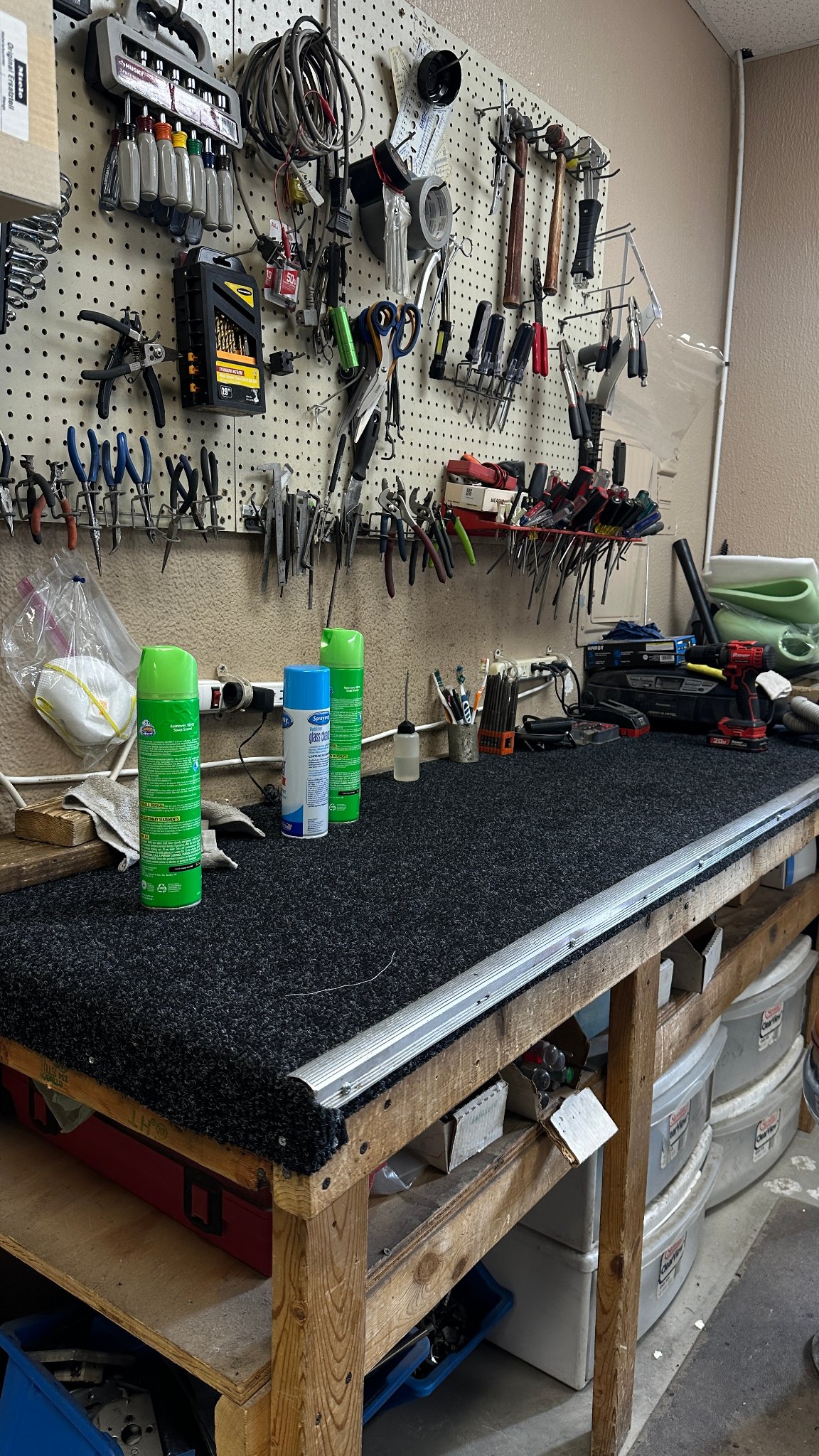 Vacuum repair shop workbench with tools
